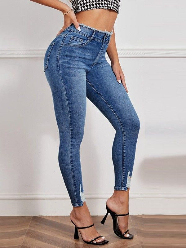 High-waisted ripped stretch jeans