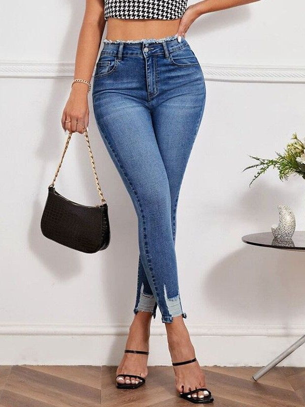 High-waisted ripped stretch jeans