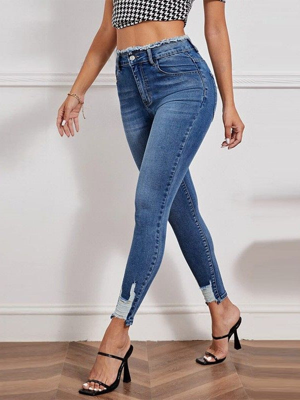 High-waisted ripped stretch jeans