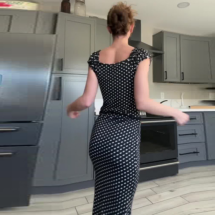 Sleeveless polka dot black bodycon suit