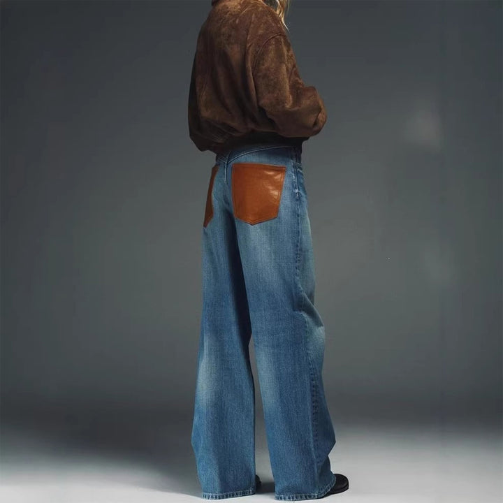 Leather patchwork washed denim jeans