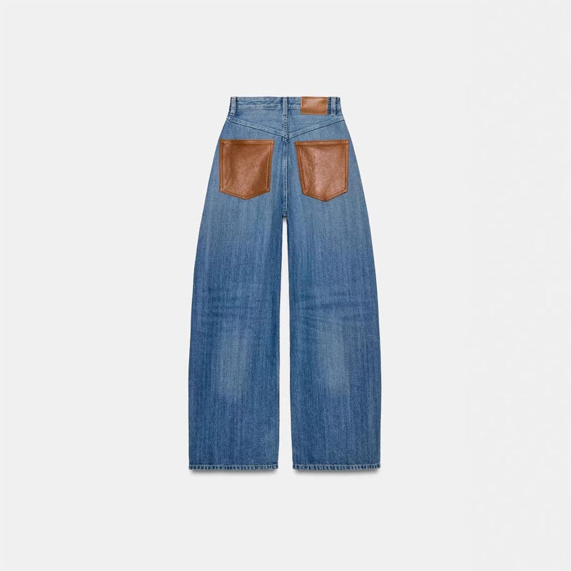 Leather patchwork washed denim jeans