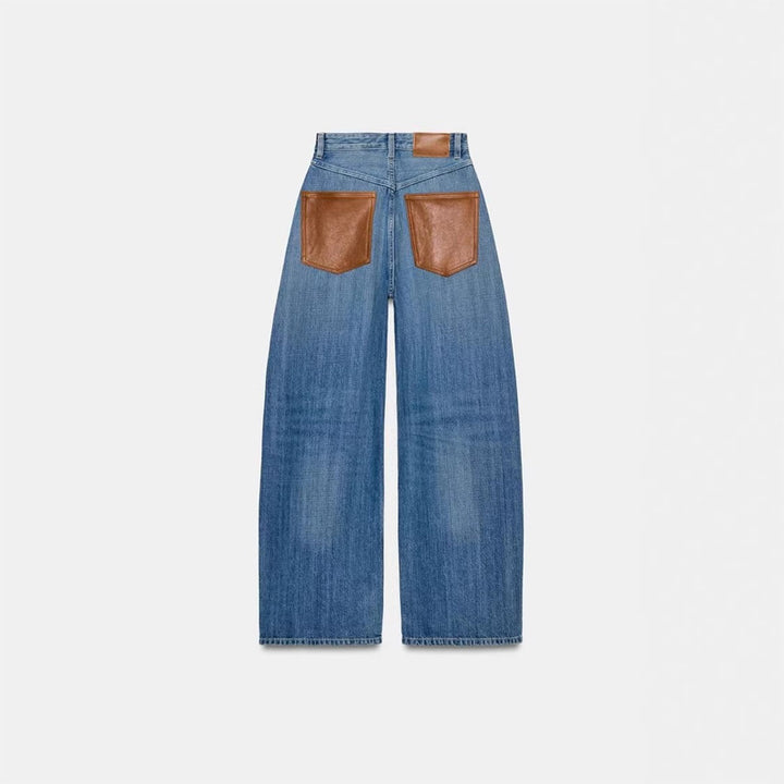 Leather patchwork washed denim jeans